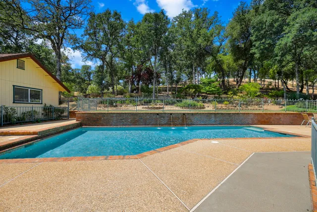 a view of a house with swimming pool