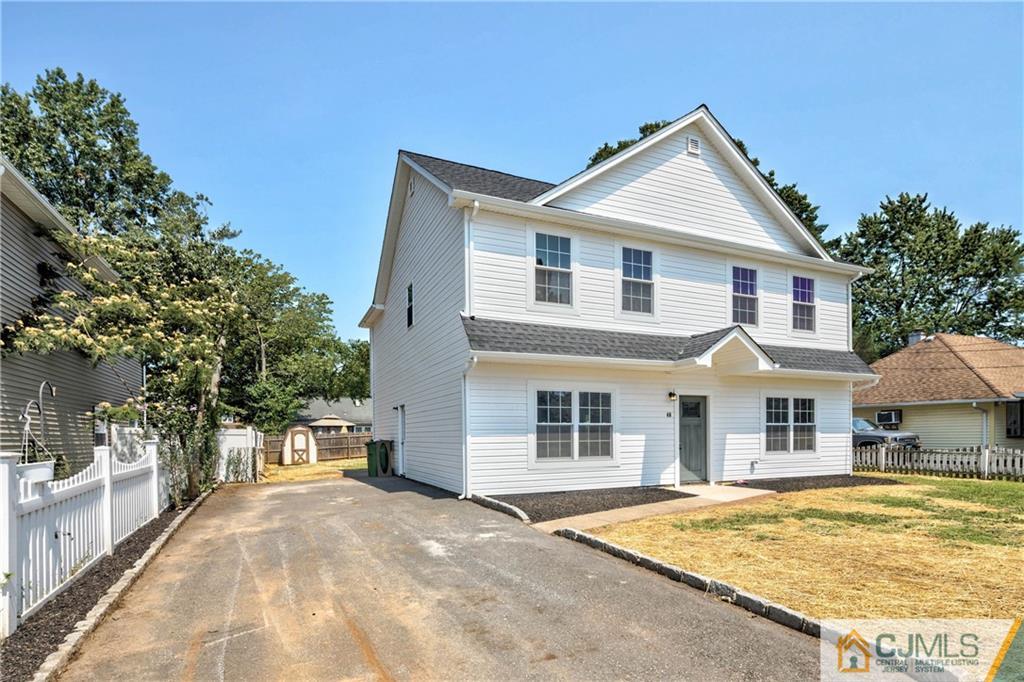 48 Brookville Road Edison, NJ 08817 - Photo 3 of 28 a front view of a house with a yard