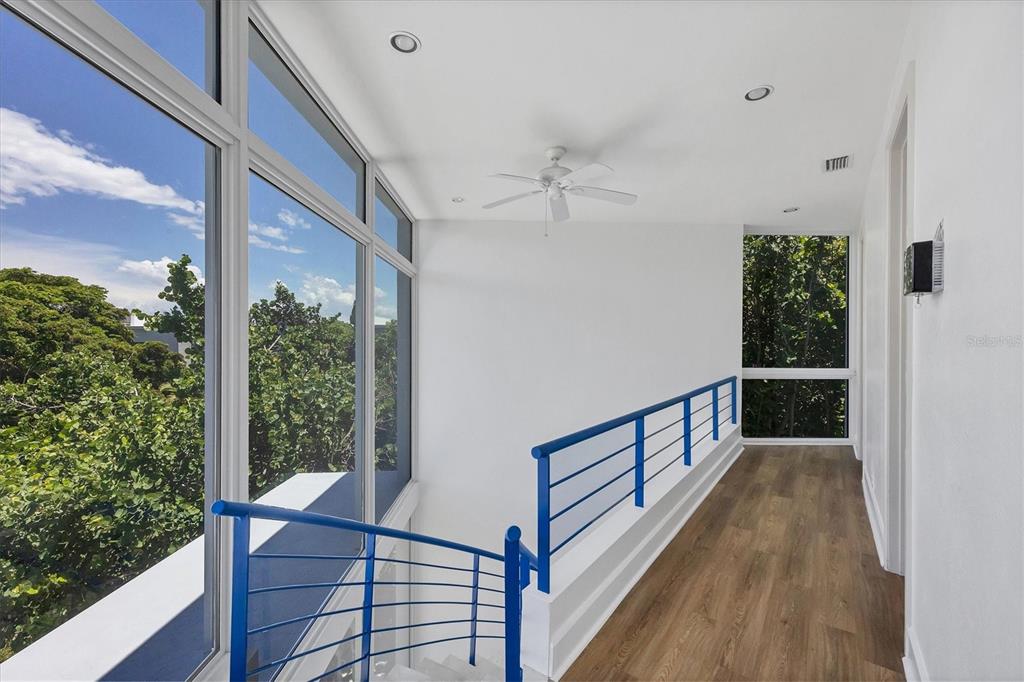 5801 Gulf Of Mexico Drive Longboat Key, FL 34228 - Photo 14 of 52 a view of a balcony with wooden floor