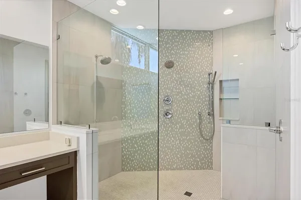 a bathroom with a shower and a sink