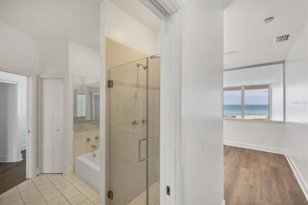5801 Gulf Of Mexico Drive Longboat Key, FL 34228 - Photo 22 of 52 a bathroom with a shower and a sink