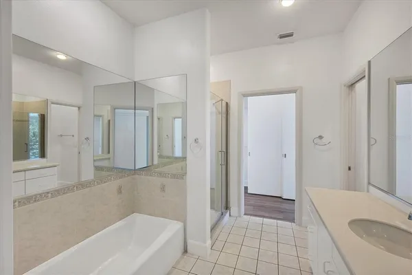 a bathroom with a bathtub and a shower
