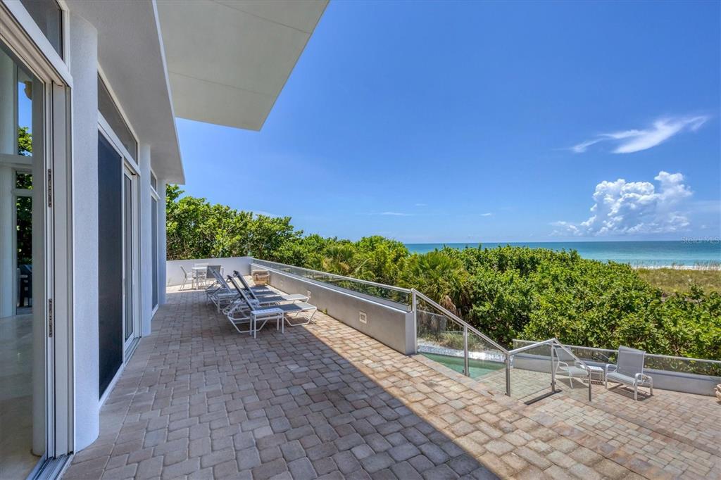 5801 Gulf Of Mexico Drive Longboat Key, FL 34228 - Photo 33 of 52 a view of balcony with furniture