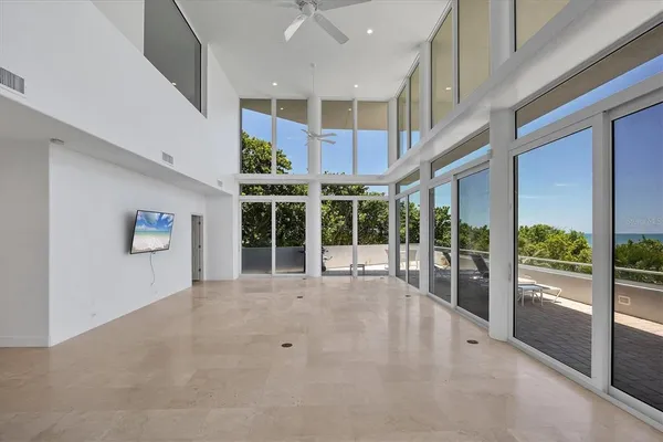 a view of an entryway with a floor to ceiling window