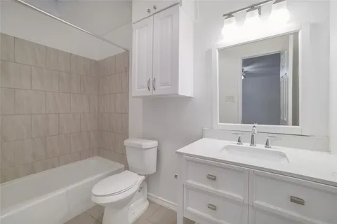 a bathroom with a sink a toilet and bathtub