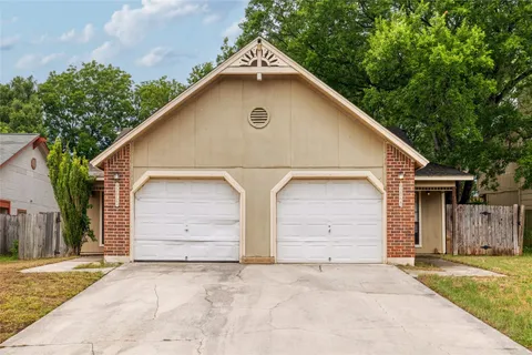 a view of garage yard and tree