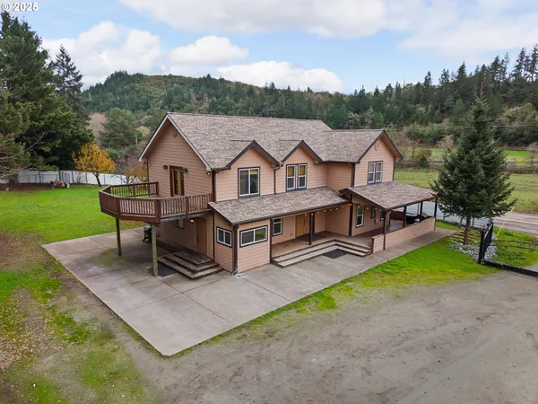 a view of a house with pool table and chairs