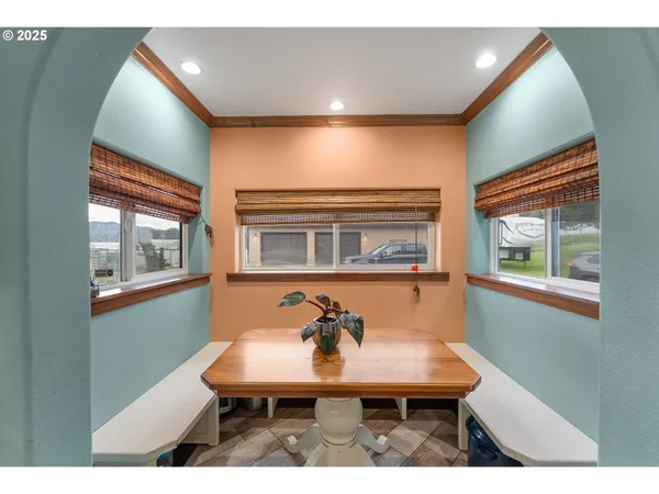 a balcony with table and chairs