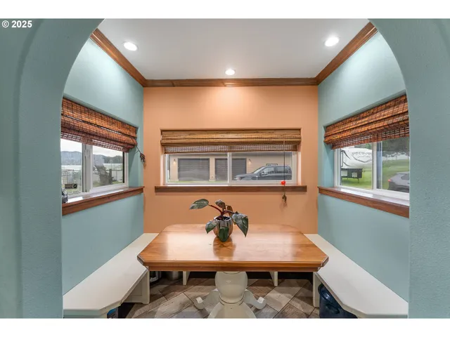 a balcony with table and chairs