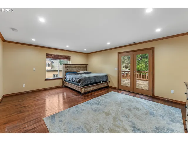 a living room with furniture and large window