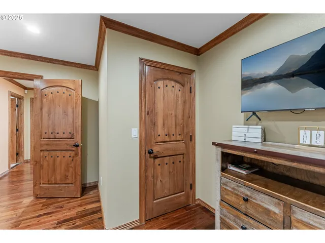 a kitchen with a refrigerator and cabinets