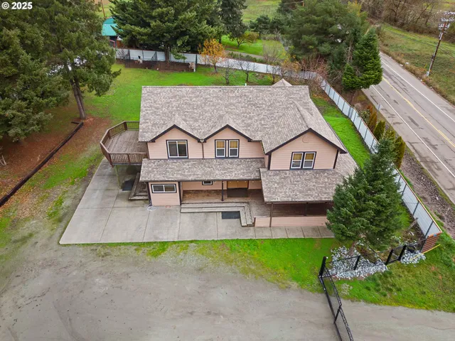an aerial view of a residential houses with outdoor space