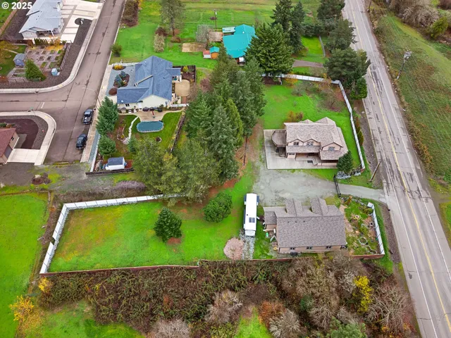 an aerial view of residential house and green space