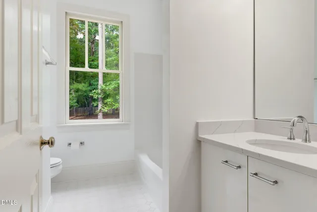 a view of a hallway with a chandelier