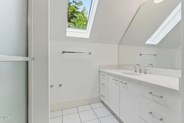 a view of an empty room with windows