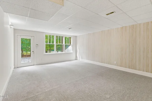 a view of an empty room with stairs