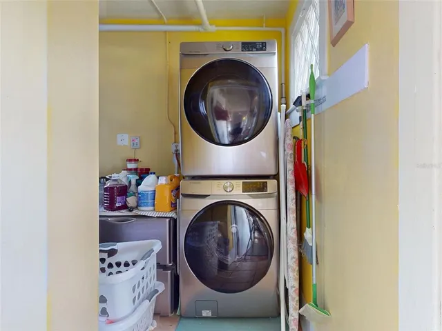 a living room with furniture and painting on the wall