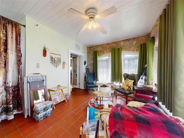 a bedroom with bed and a fireplace