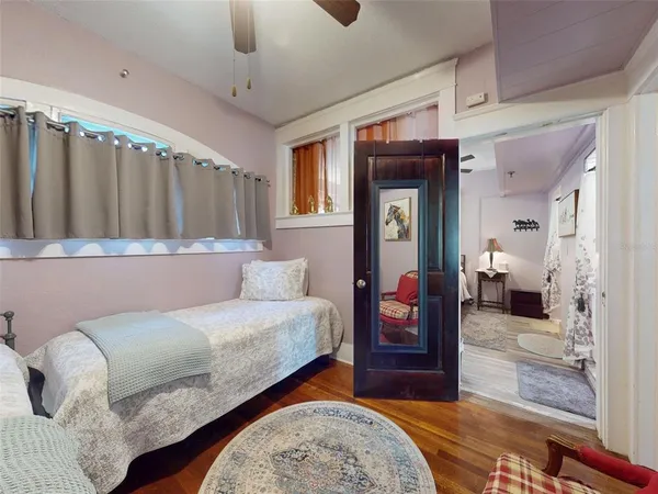 a bedroom with a bed and a window