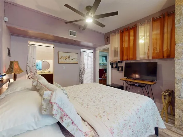 a bathroom with a shower and a sink