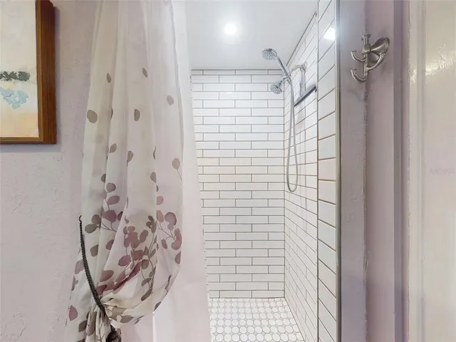 a bedroom with a bed next to a window with the outer view