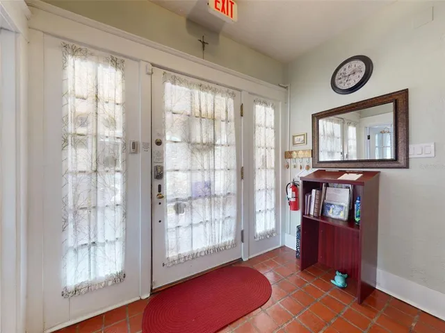 a bathroom with a sink and mirror with shower