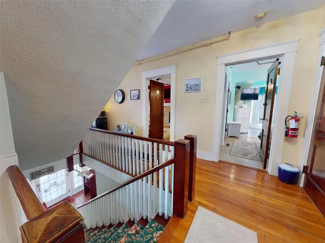 a bedroom with a large bed and a couch