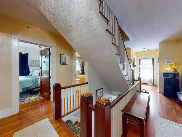 a bathroom with a sink mirror and a painting on the wall