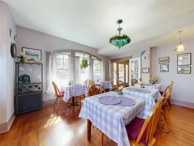 a kitchen with stainless steel appliances granite countertop a sink and a refrigerator