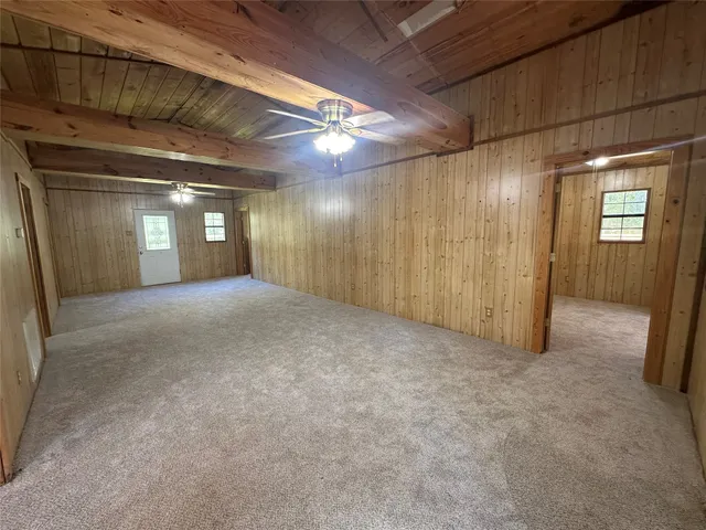 a view of a hallway with a kitchen