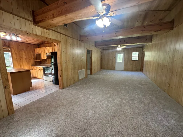 a kitchen with a refrigerator and a sink