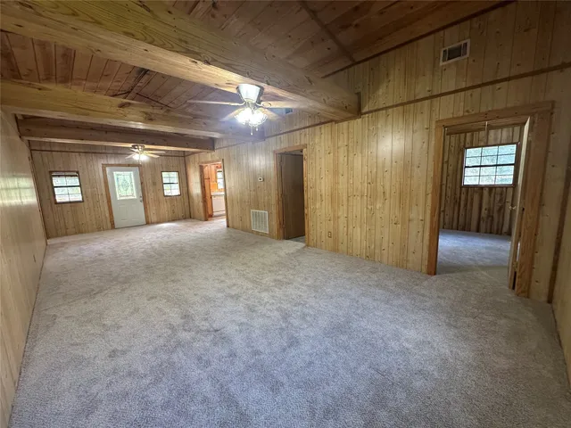 a view of balcony with yard