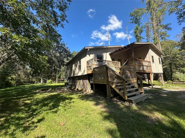 a view of a house with a big yard