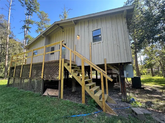 a backyard of a house with table and chairs