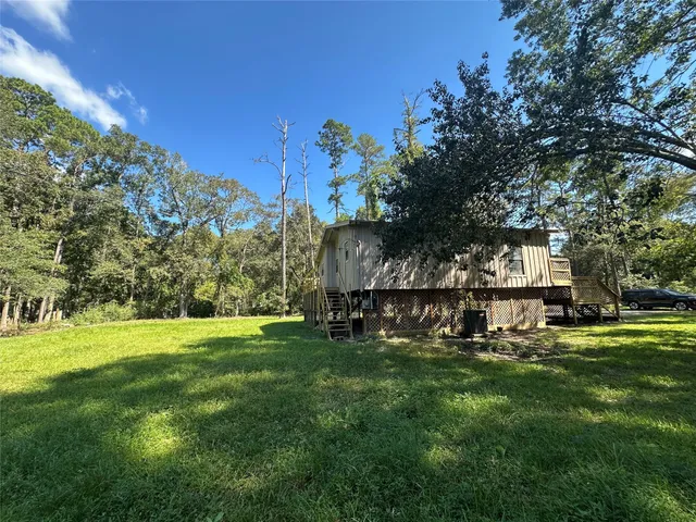 a view of a park with large trees