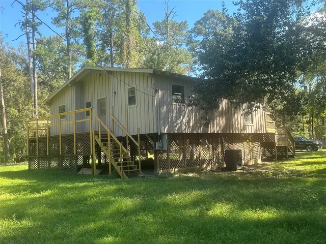 a view of a park with large trees