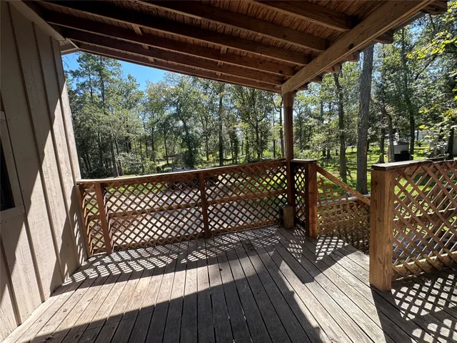 a view of balcony with wooden floor