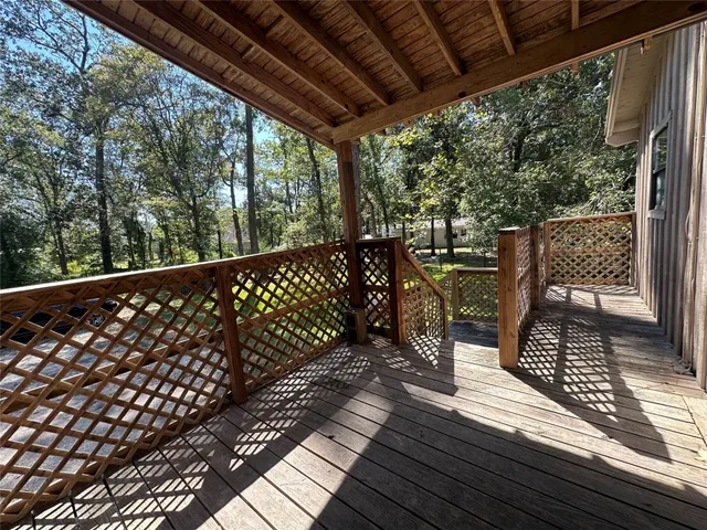 a view of a pathway of a house with a yard