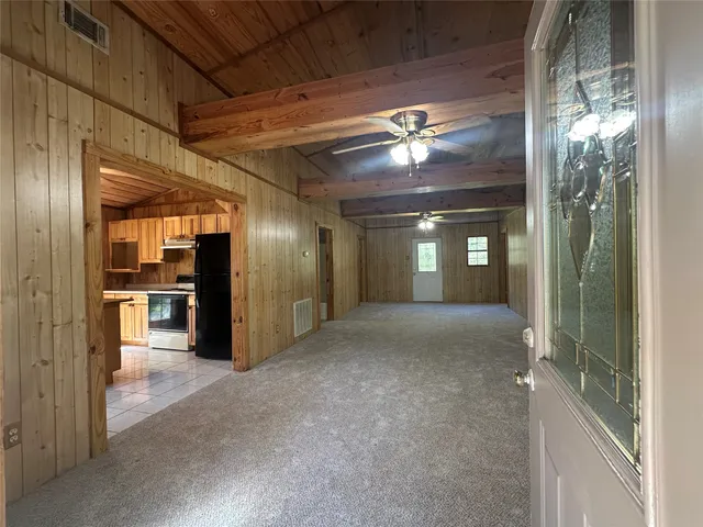 a view of a hallway with an empty room