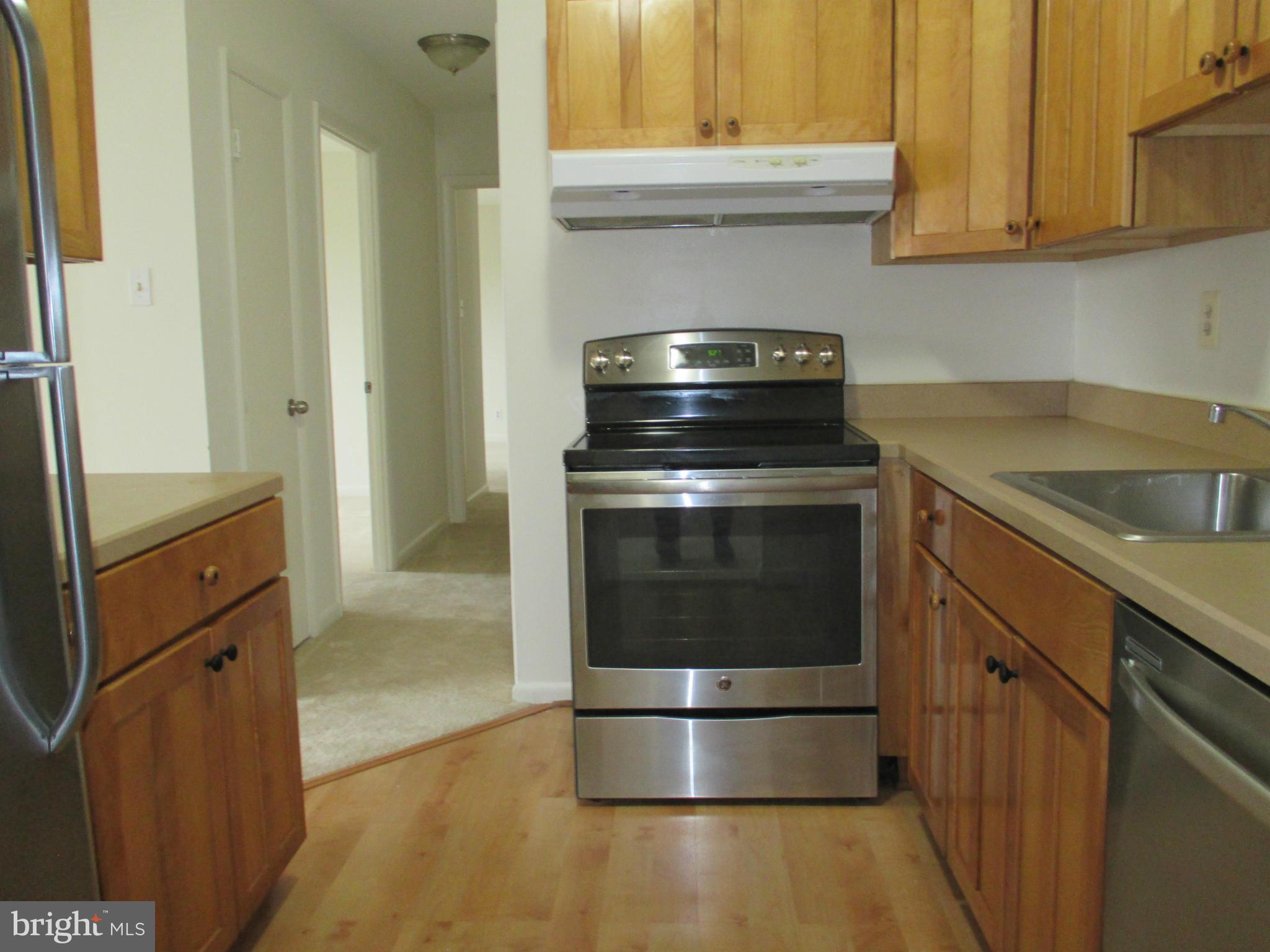 6260 Edsall Road, Unit 403 Alexandria, VA 22312 - Photo 15 of 15 a kitchen with a stove and a sink