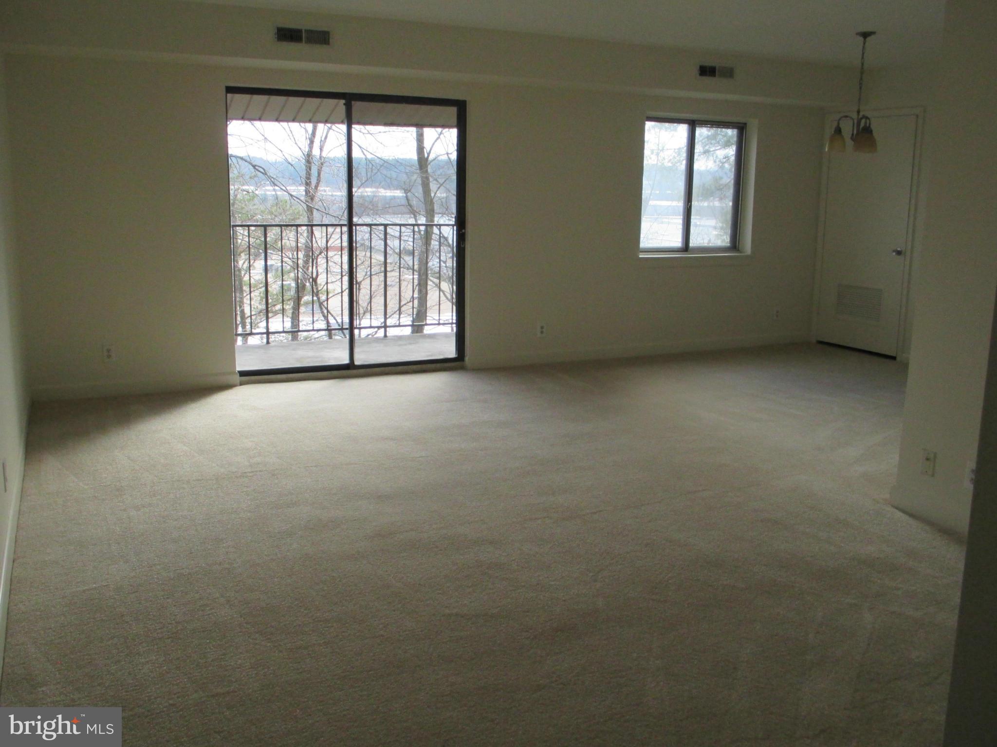 6260 Edsall Road, Unit 403 Alexandria, VA 22312 - Photo 4 of 15 an empty room with windows