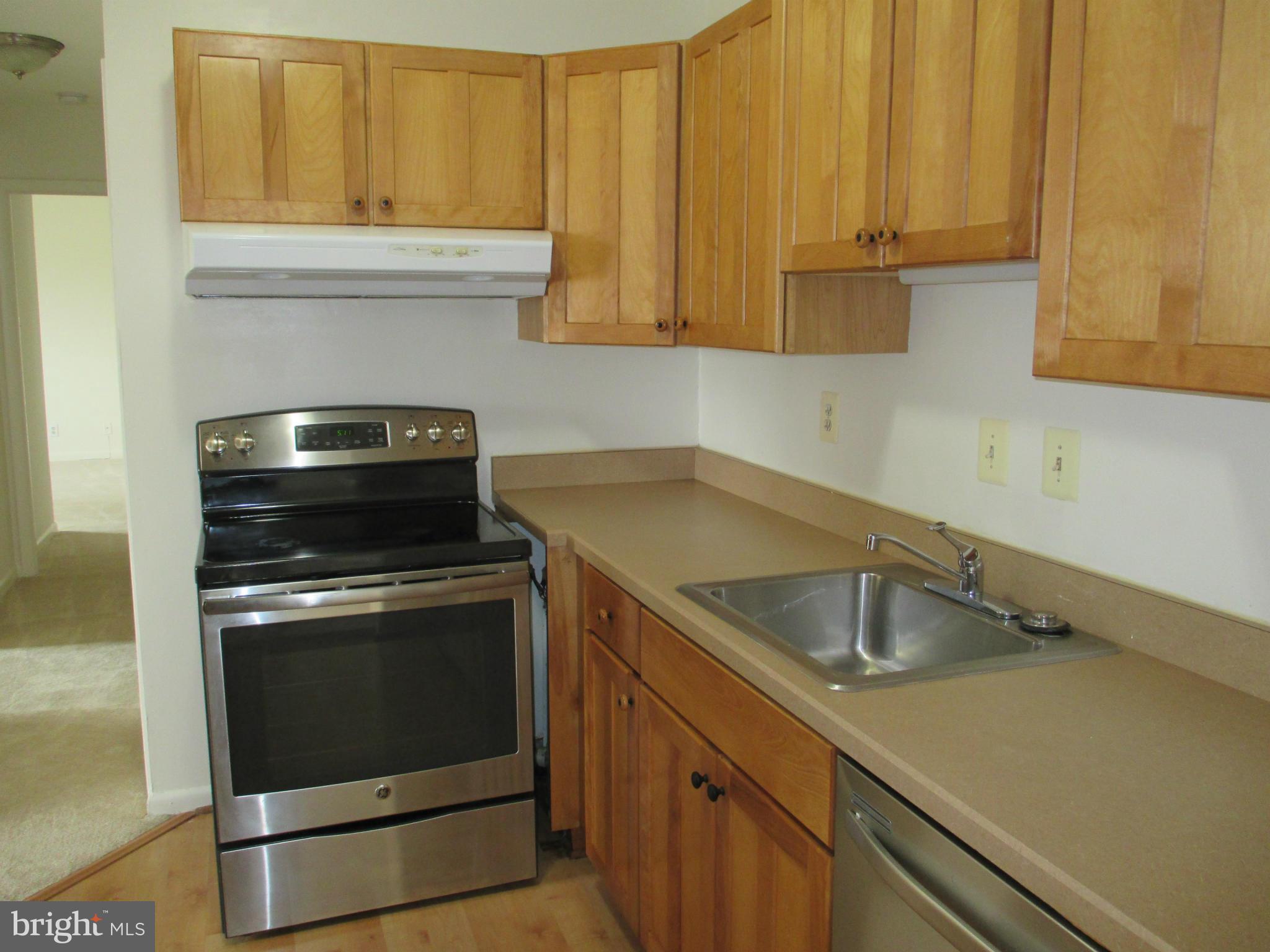 6260 Edsall Road, Unit 403 Alexandria, VA 22312 - Photo 7 of 15 a kitchen with a sink and cabinets