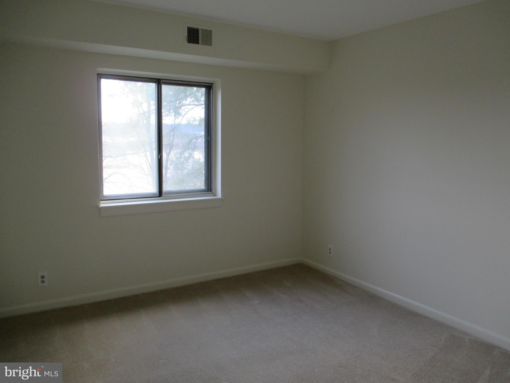 6260 Edsall Road, Unit 403 Alexandria, VA 22312 - Photo 10 of 15 an empty room with a window