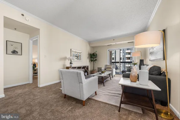 a balcony with table and chairs