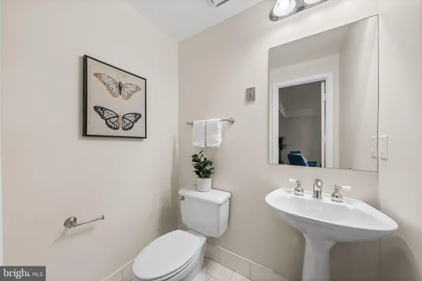 a kitchen with stainless steel appliances granite countertop a sink a stove counter space and cabinets