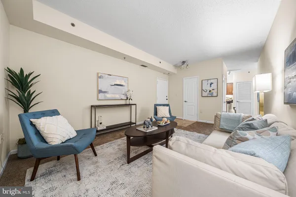 a kitchen with stainless steel appliances granite countertop a refrigerator and a stove