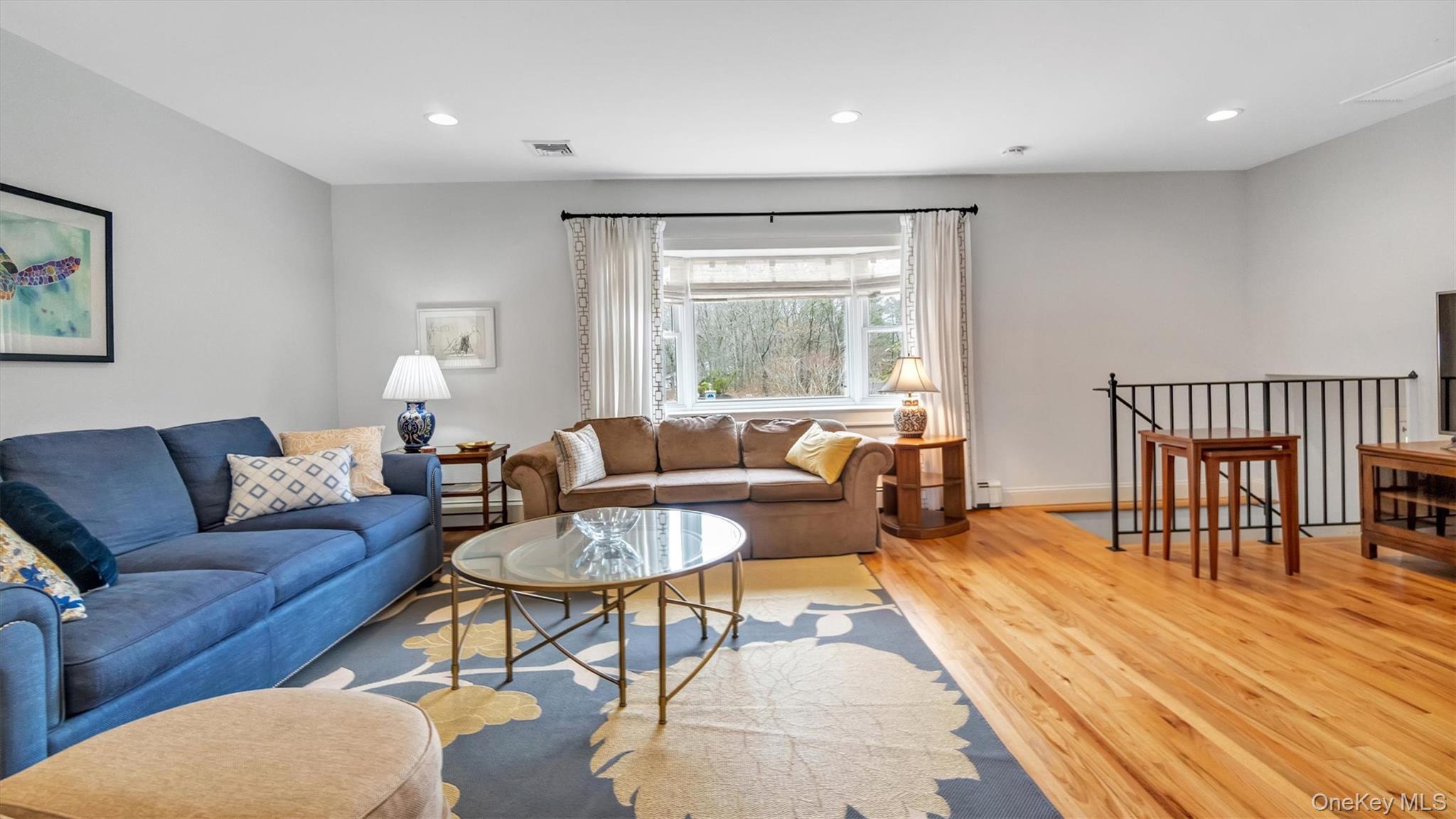 3 Debbie Trail Hampton Bays, NY 11946 - Photo 22 of 29 Living room featuring recessed lighting, visible vents, and light wood-style flooring