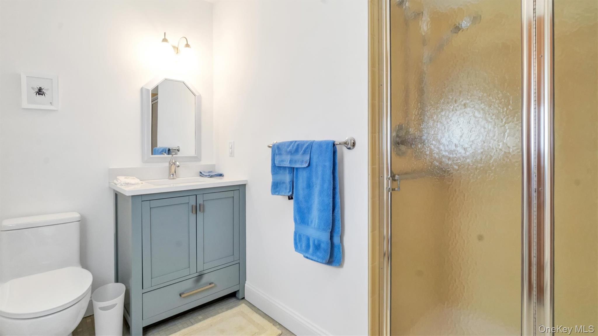 3 Debbie Trail Hampton Bays, NY 11946 - Photo 27 of 29 Full bathroom featuring a shower stall, toilet, and vanity