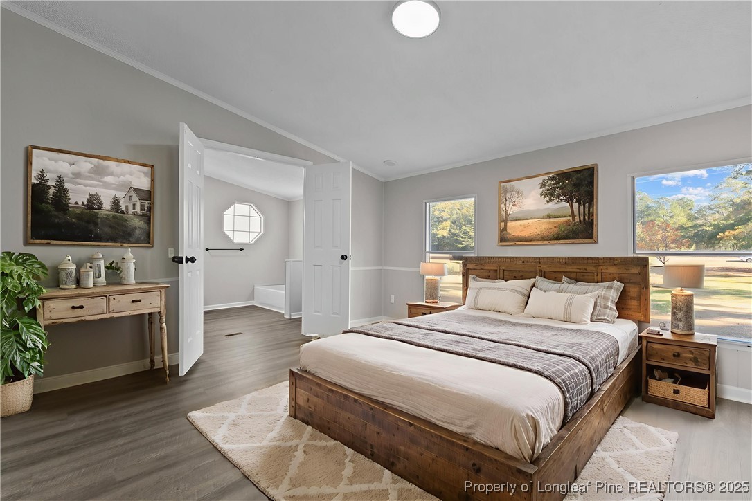 5888 Butler Nursery Road Fayetteville, NC 28306 - Photo 13 of 42 a spacious bedroom with a bed and a flat screen tv