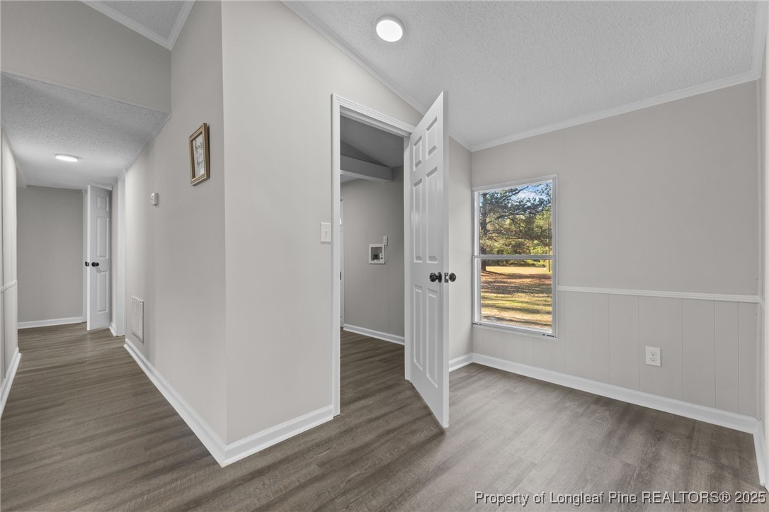 5888 Butler Nursery Road Fayetteville, NC 28306 - Photo 21 of 42 an empty room with wooden floor and a window
